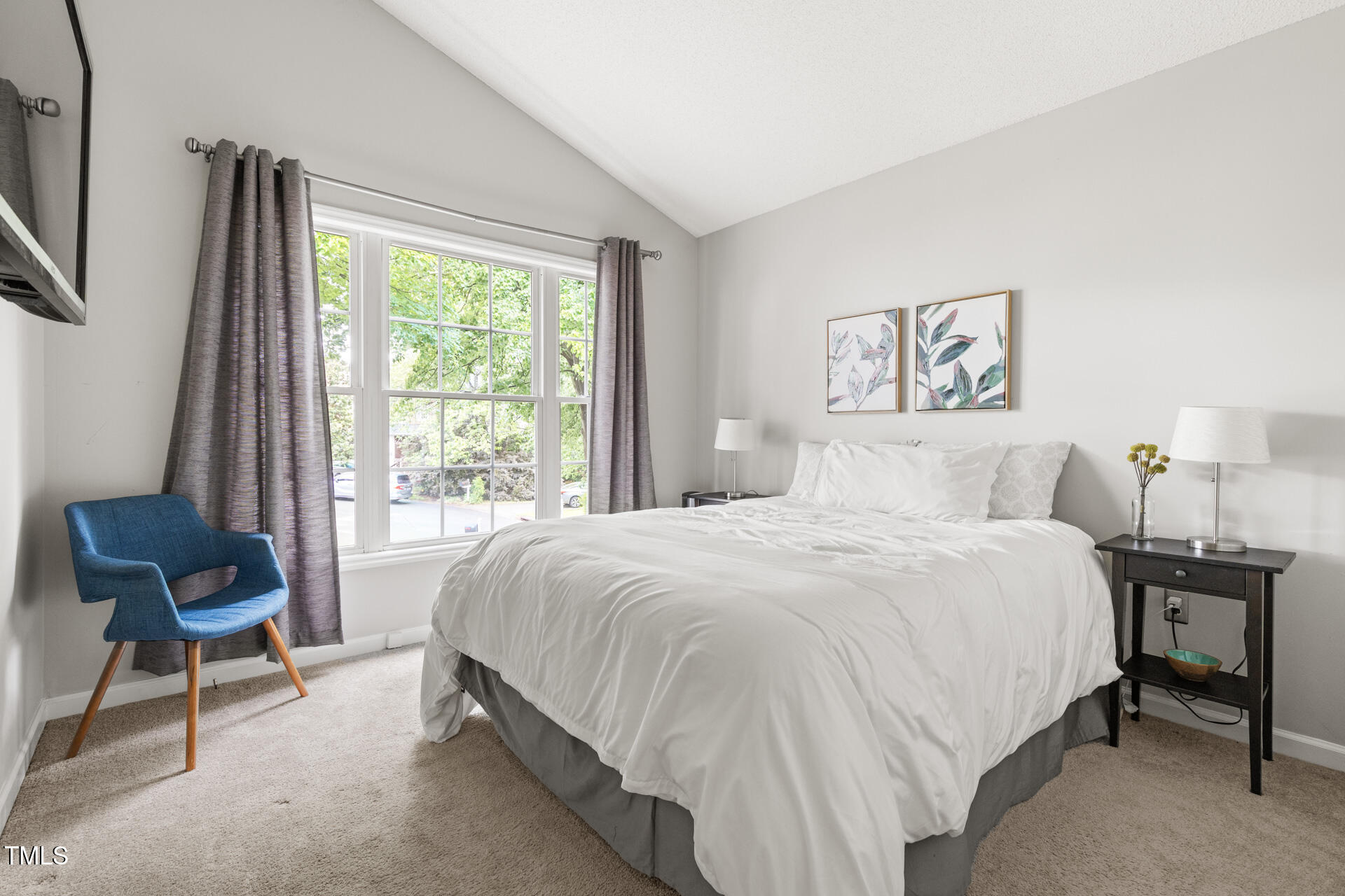 2301 Bolingbrook Lane Raleigh, NC 27613 - Photo 27 of 36 a bedroom with a bed and a chair