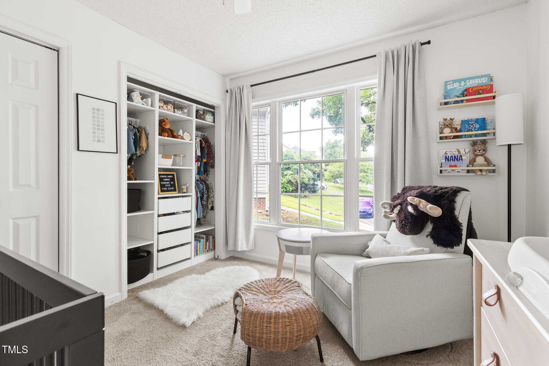 2301 Bolingbrook Lane Raleigh, NC 27613 - Photo 29 of 36 a living room with furniture and a window