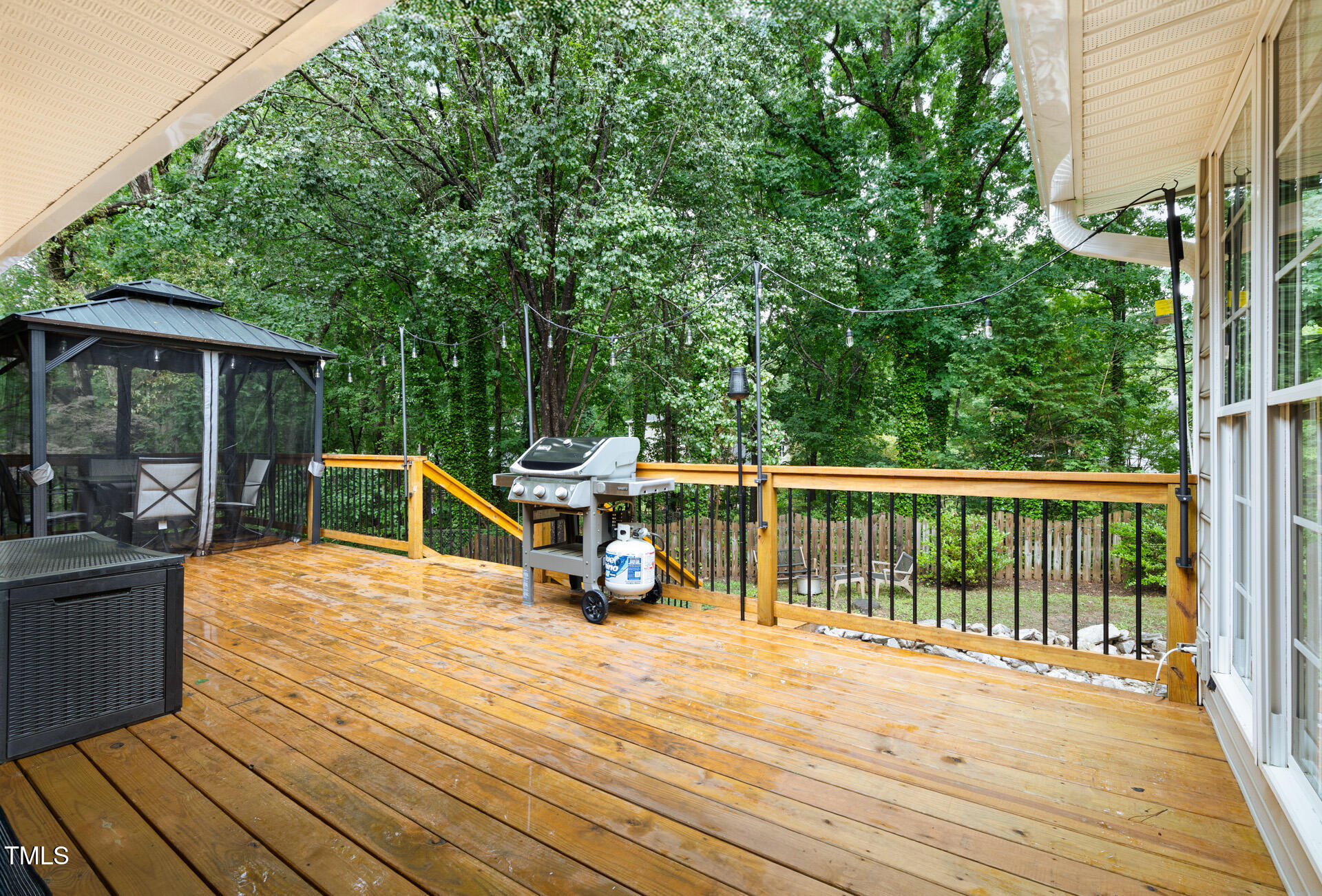 2301 Bolingbrook Lane Raleigh, NC 27613 - Photo 31 of 36 a view of a balcony with chairs and wooden floor