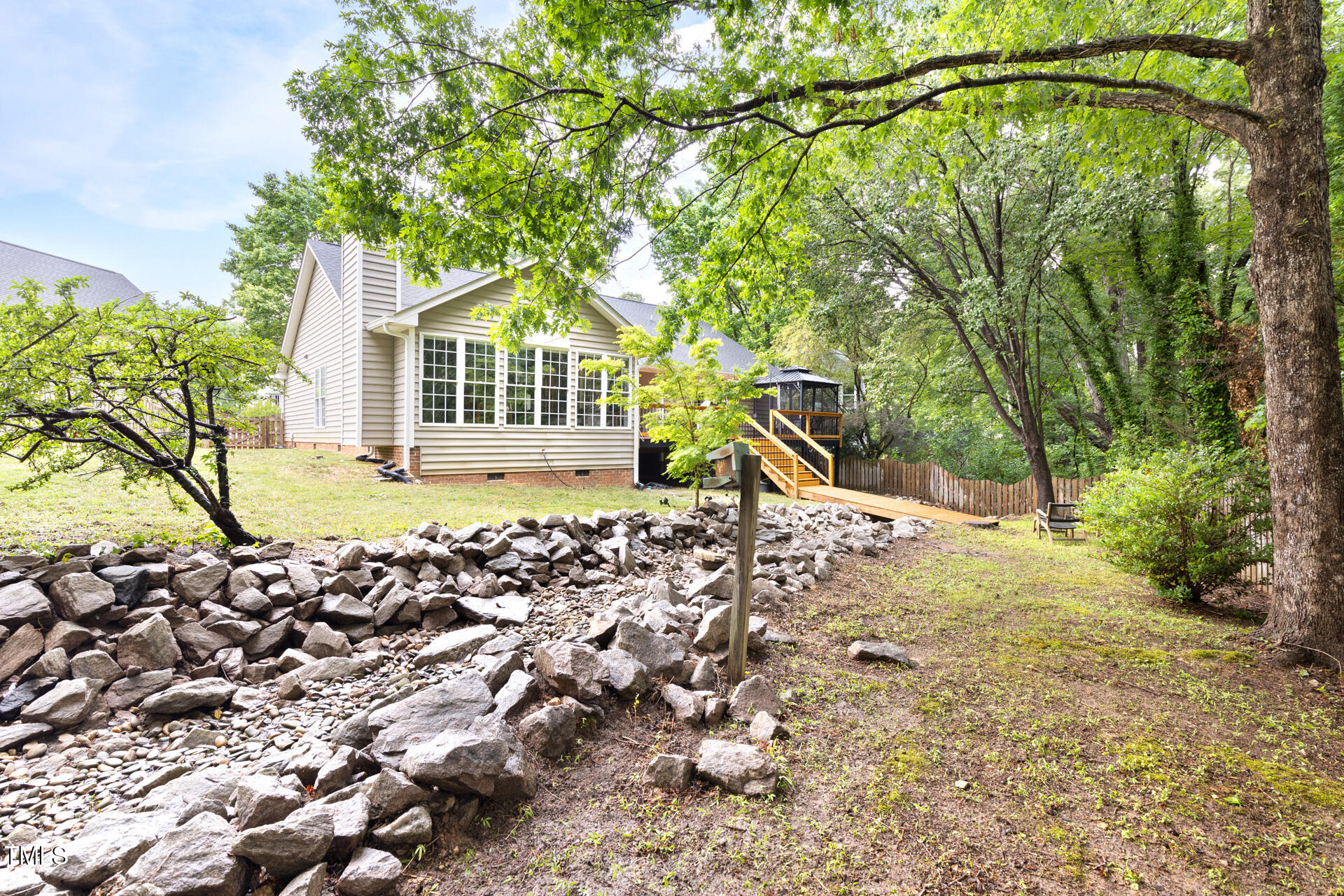 2301 Bolingbrook Lane Raleigh, NC 27613 - Photo 35 of 36 a view of a house with a tree in the yard
