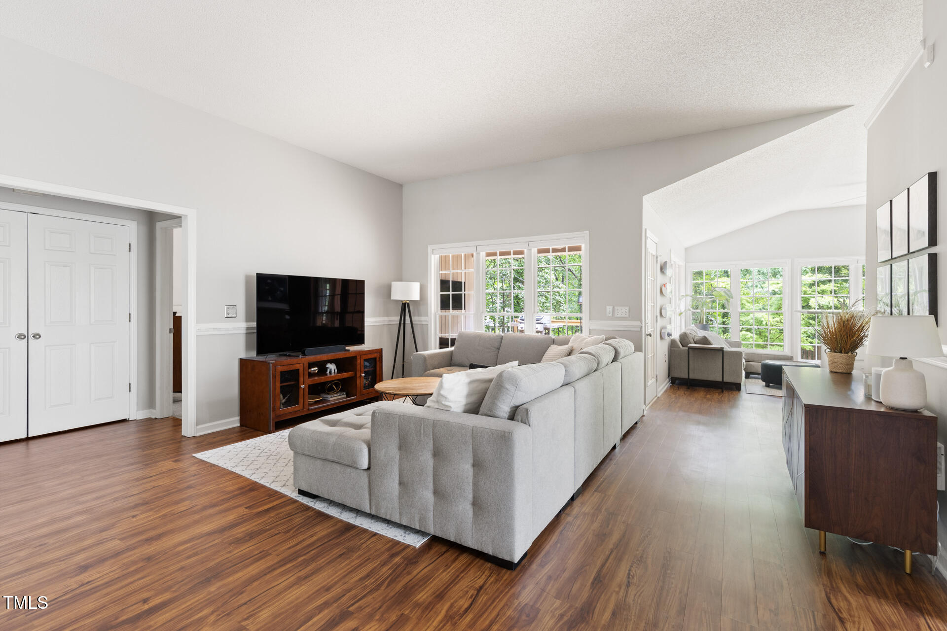 2301 Bolingbrook Lane Raleigh, NC 27613 - Photo 6 of 36 a living room with furniture and a flat screen tv