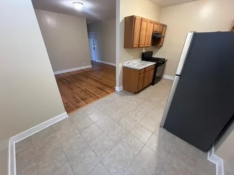 a view of living room with furniture and wooden floor