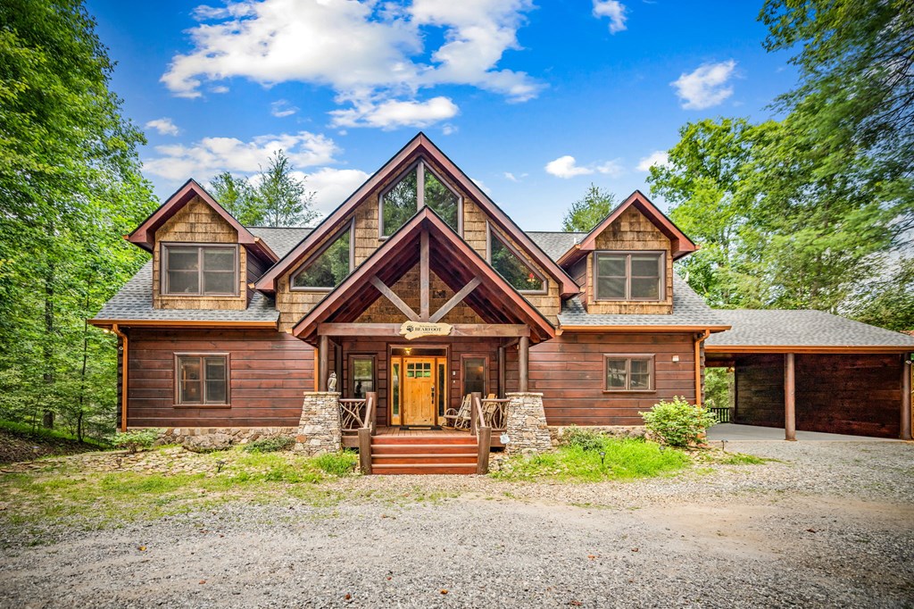 1082 Sunset Road Epworth, GA 30541 - Photo 18 of 98 a front view of a house with garden