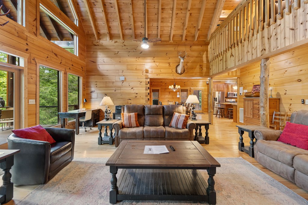 1082 Sunset Road Epworth, GA 30541 - Photo 38 of 98 a living room with furniture and a floor to ceiling window