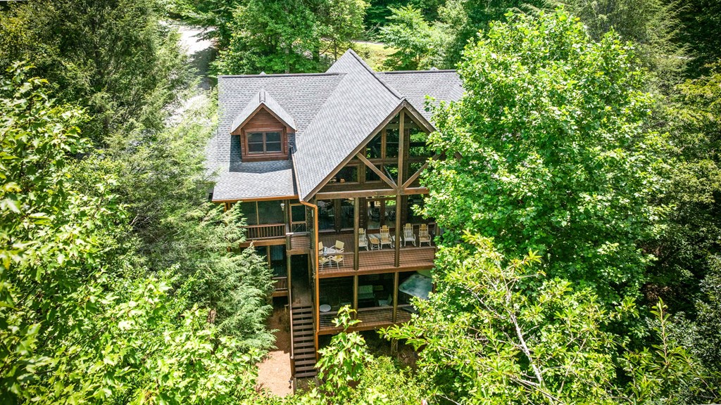 1082 Sunset Road Epworth, GA 30541 - Photo 6 of 98 a house with trees in front of it