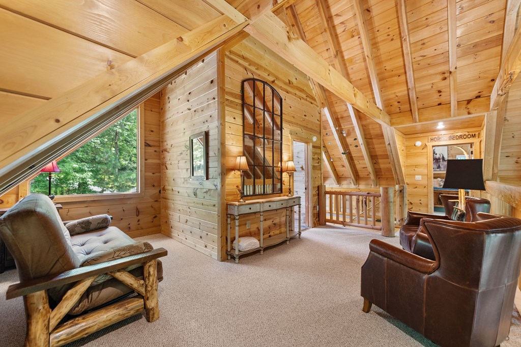 1082 Sunset Road Epworth, GA 30541 - Photo 62 of 98 a living room with furniture a flat screen tv and a window