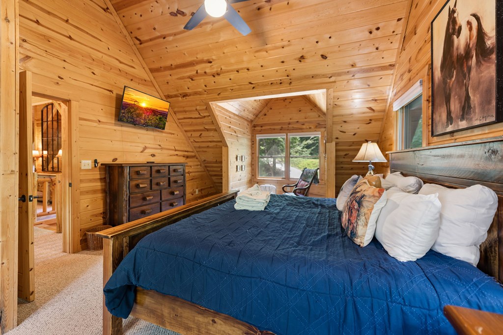 1082 Sunset Road Epworth, GA 30541 - Photo 67 of 98 a bedroom with a bed and wooden floor