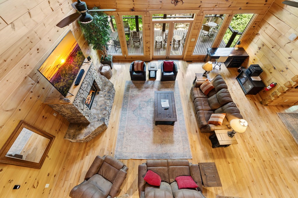 1082 Sunset Road Epworth, GA 30541 - Photo 73 of 98 a living room with furniture and a floor to ceiling window