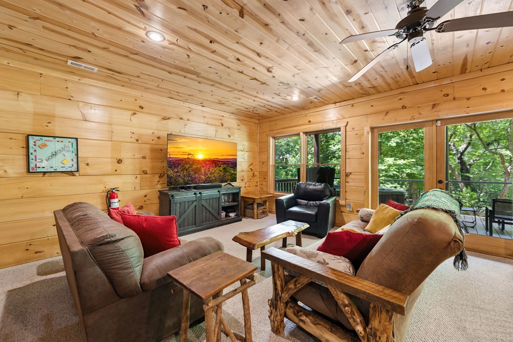 1082 Sunset Road Epworth, GA 30541 - Photo 77 of 98 a living room with furniture and a flat screen tv