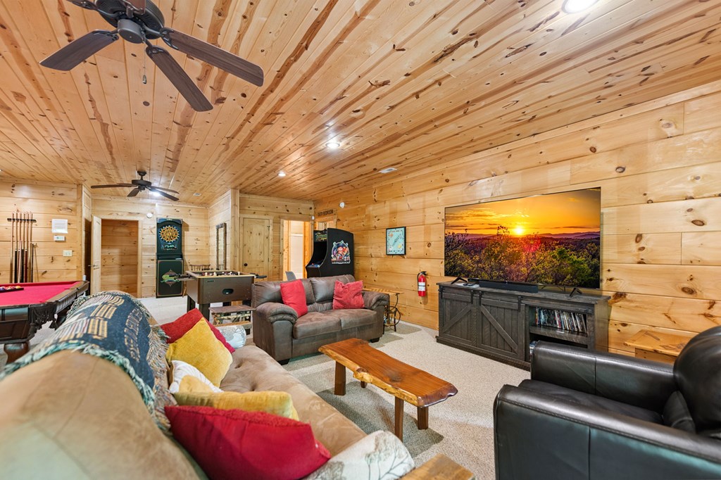 1082 Sunset Road Epworth, GA 30541 - Photo 79 of 98 a living room with furniture and a flat screen tv