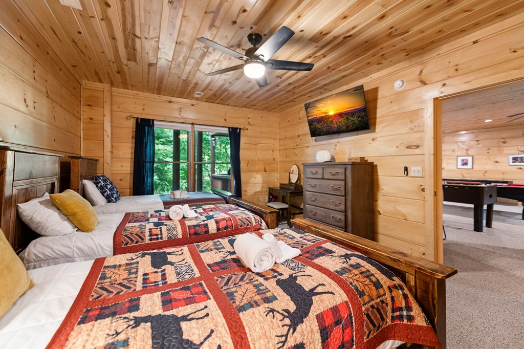 1082 Sunset Road Epworth, GA 30541 - Photo 84 of 98 a bedroom with a bed and a flat screen tv