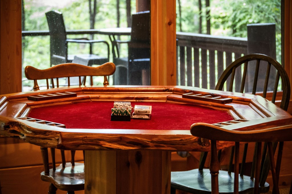1082 Sunset Road Epworth, GA 30541 - Photo 95 of 98 a view of a balcony with chairs and wooden floor