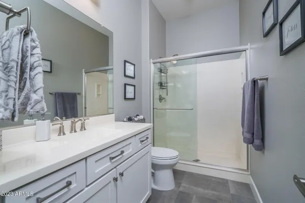 a view of a patio with table and chairs and potted plants