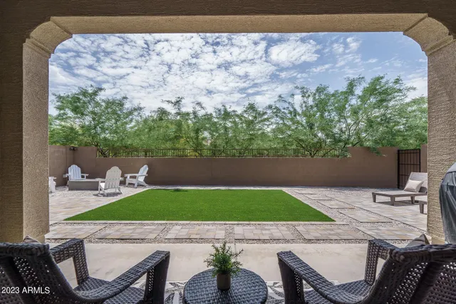 a patio with table and chairs