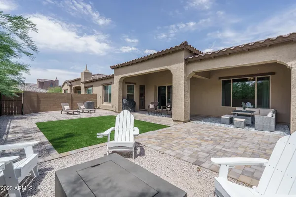 a view of a backyard with sitting area