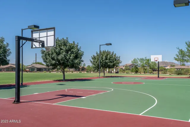 a view of a patio with table and chairs under an umbrella