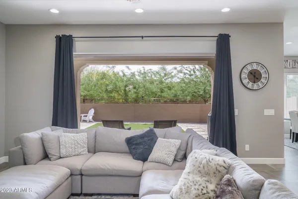 a living room with furniture and a window