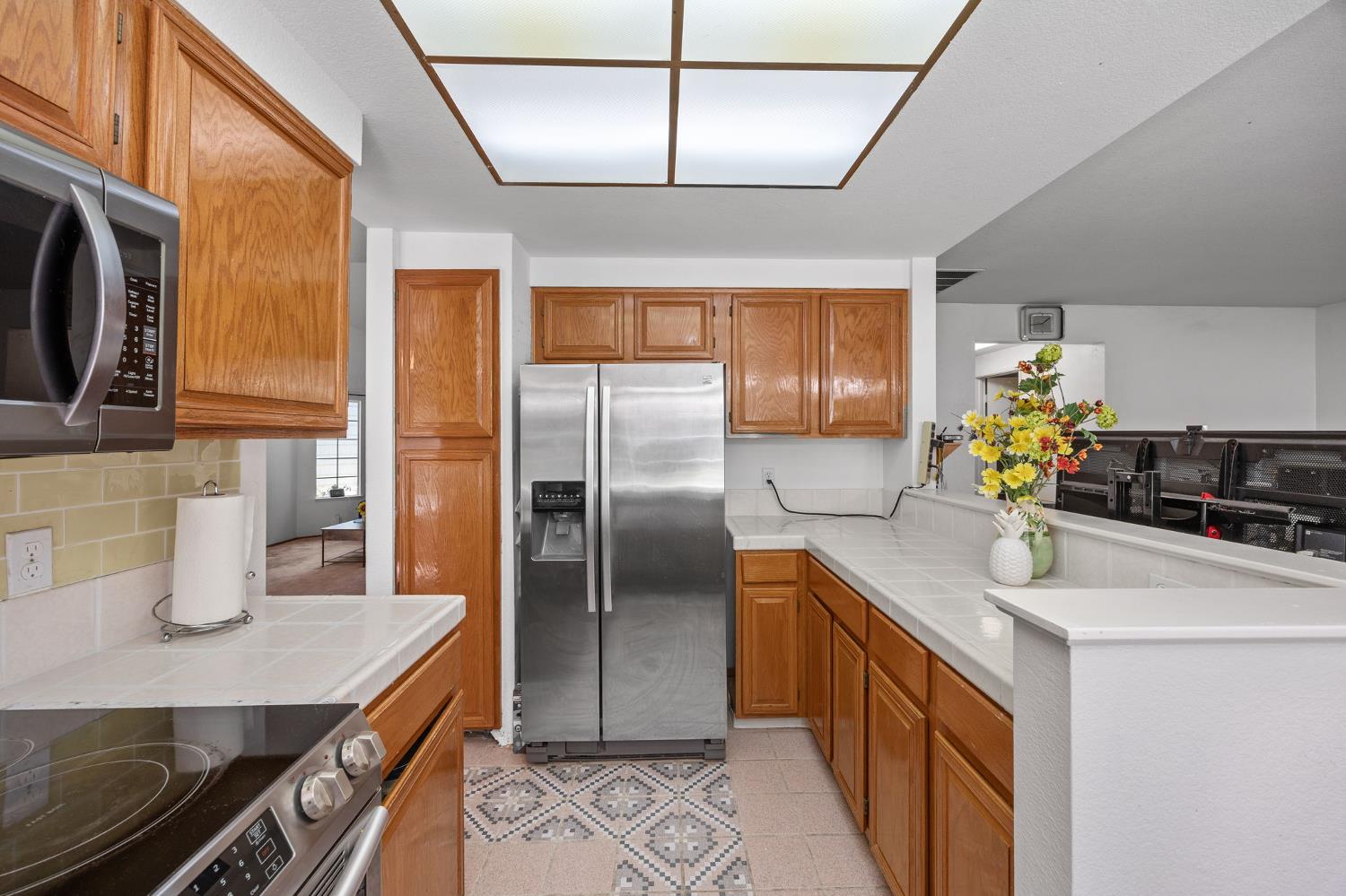 1001 Ignacio Court Pinole, CA 94564 - Photo 11 of 42 a kitchen with stainless steel appliances granite countertop a sink a refrigerator and a stove