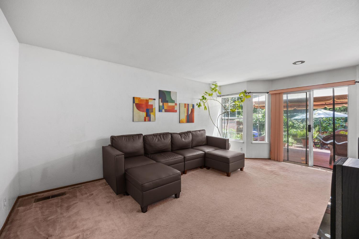 1001 Ignacio Court Pinole, CA 94564 - Photo 14 of 42 a living room with furniture and a flat screen tv