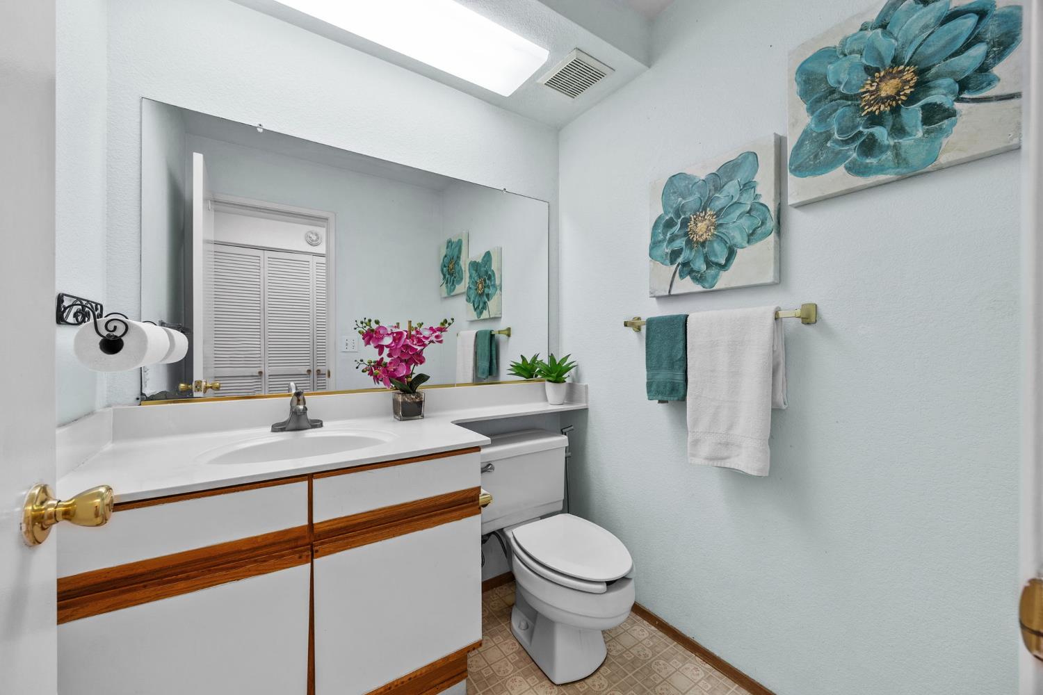 1001 Ignacio Court Pinole, CA 94564 - Photo 15 of 42 a bathroom with a sink mirror vanity and toilet