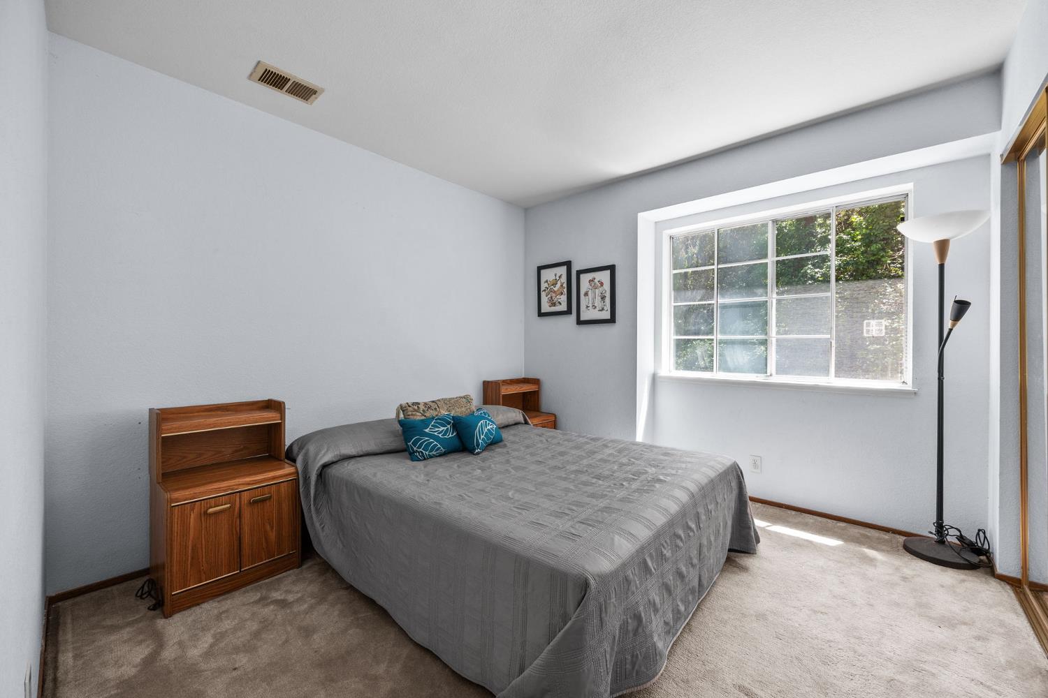 1001 Ignacio Court Pinole, CA 94564 - Photo 23 of 42 a bedroom with bed and a window