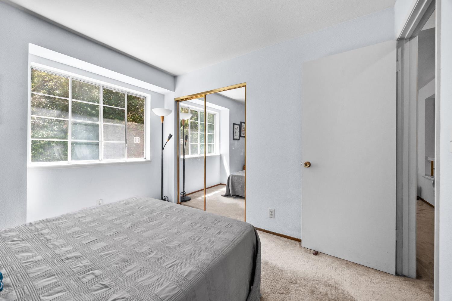 1001 Ignacio Court Pinole, CA 94564 - Photo 24 of 42 a bedroom with a bed and a large window