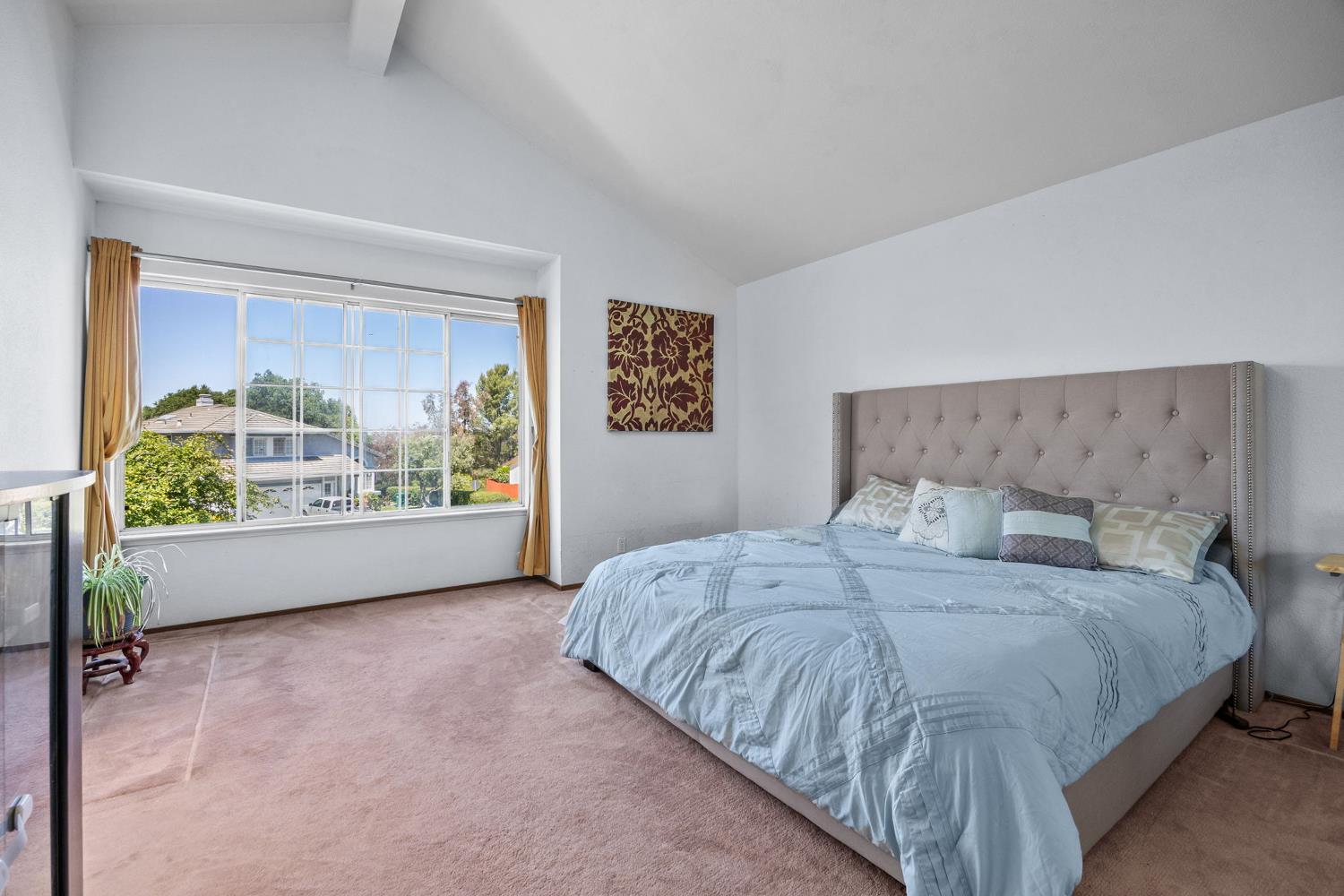 1001 Ignacio Court Pinole, CA 94564 - Photo 27 of 42 a bedroom with a bed and a large window