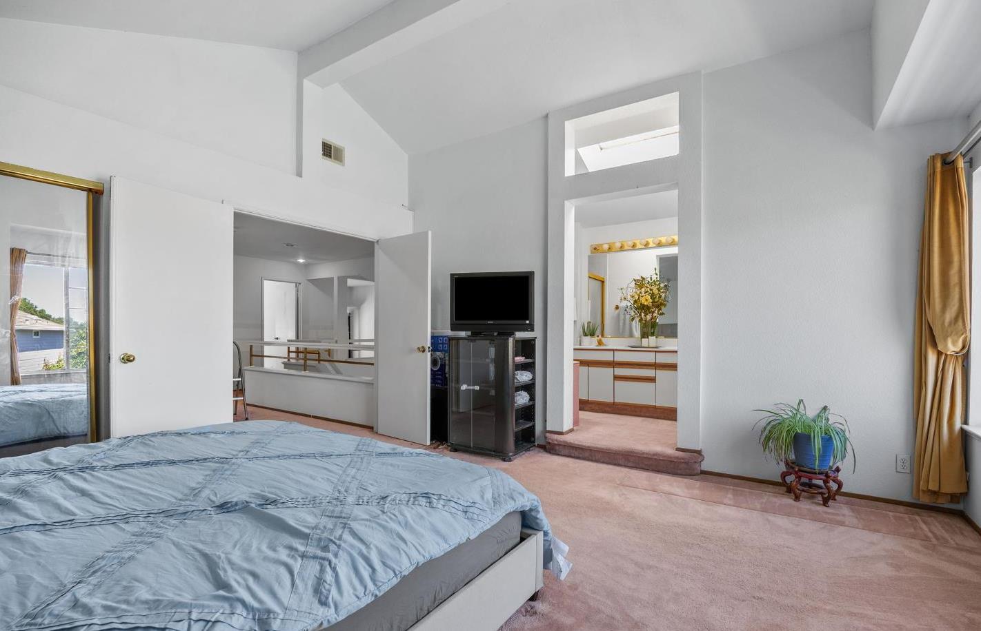 1001 Ignacio Court Pinole, CA 94564 - Photo 28 of 42 a bedroom with a bed and a flat tv screen in it