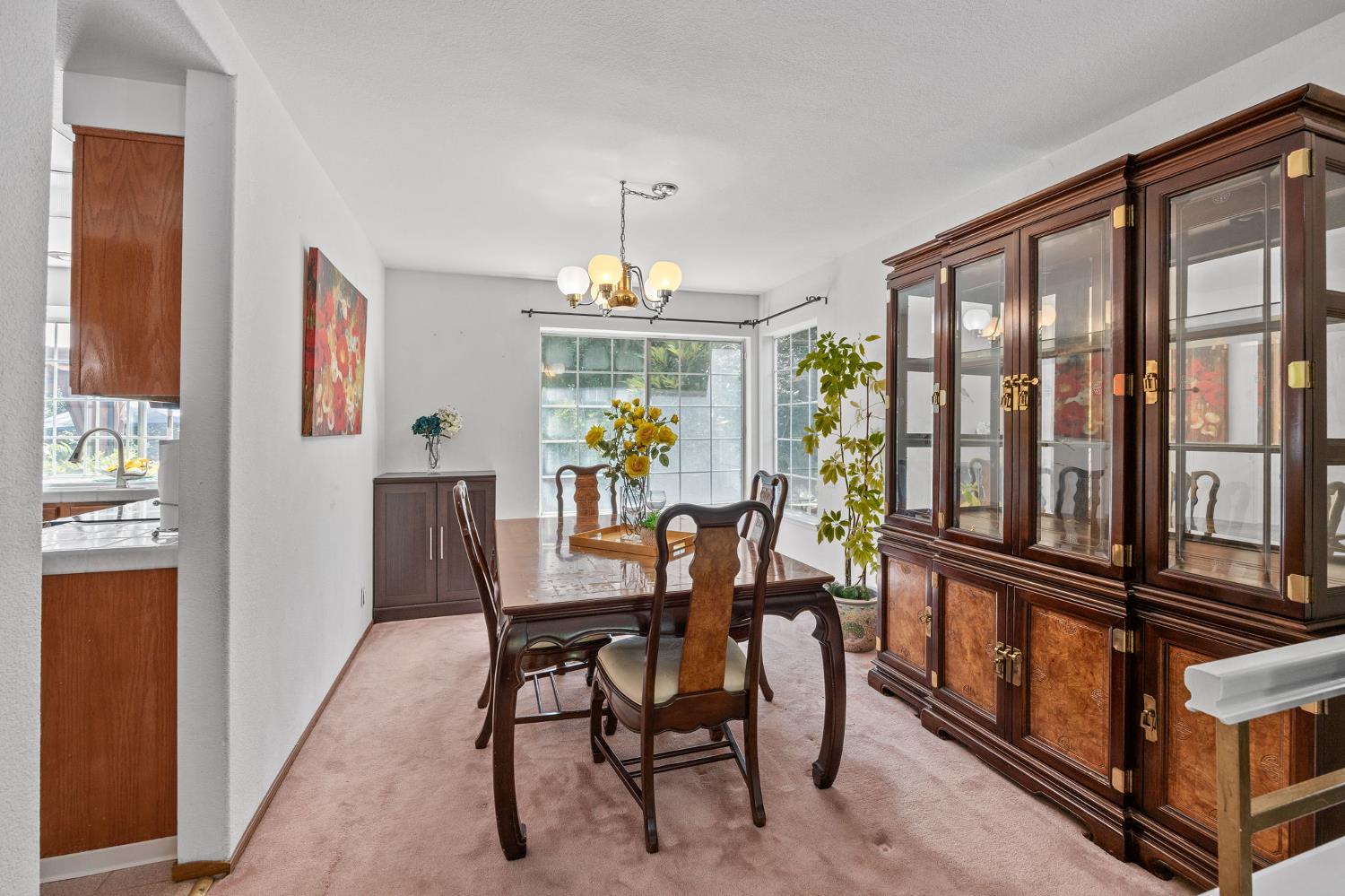 1001 Ignacio Court Pinole, CA 94564 - Photo 7 of 42 a view of a dining room with furniture large window and wooden floor