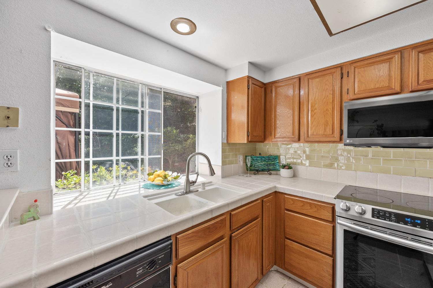 1001 Ignacio Court Pinole, CA 94564 - Photo 9 of 42 a kitchen with a sink and a microwave
