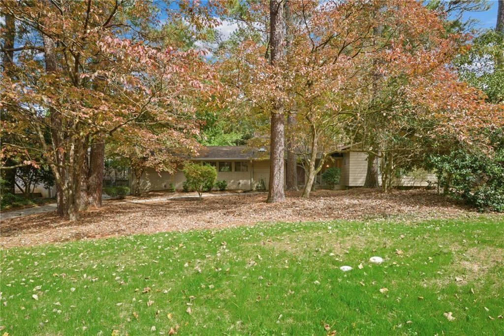705 Edgewater Trail Sandy Springs, GA 30328 - Photo 36 of 36 a view of a yard with a house and large trees