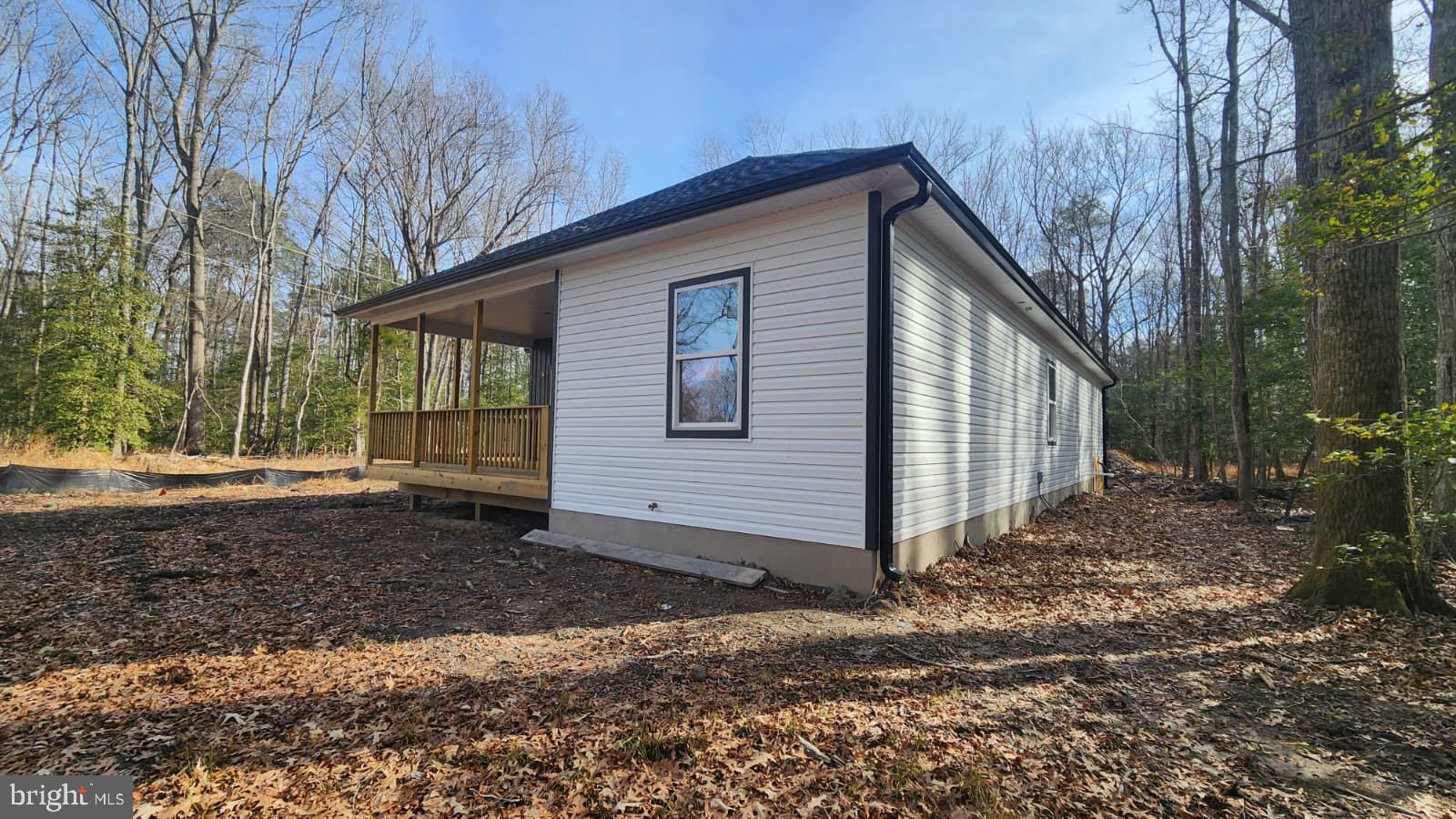 175 Rose Way Colonial Beach, VA 22443 - Photo 15 of 16 a view of a house with a yard