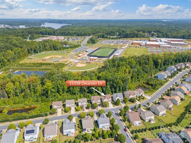 a sign on the side of a wooden fence