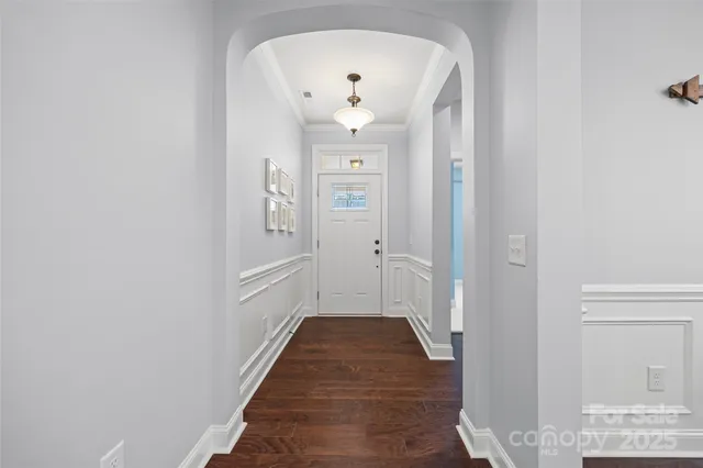 a view of a hallway with a white walls