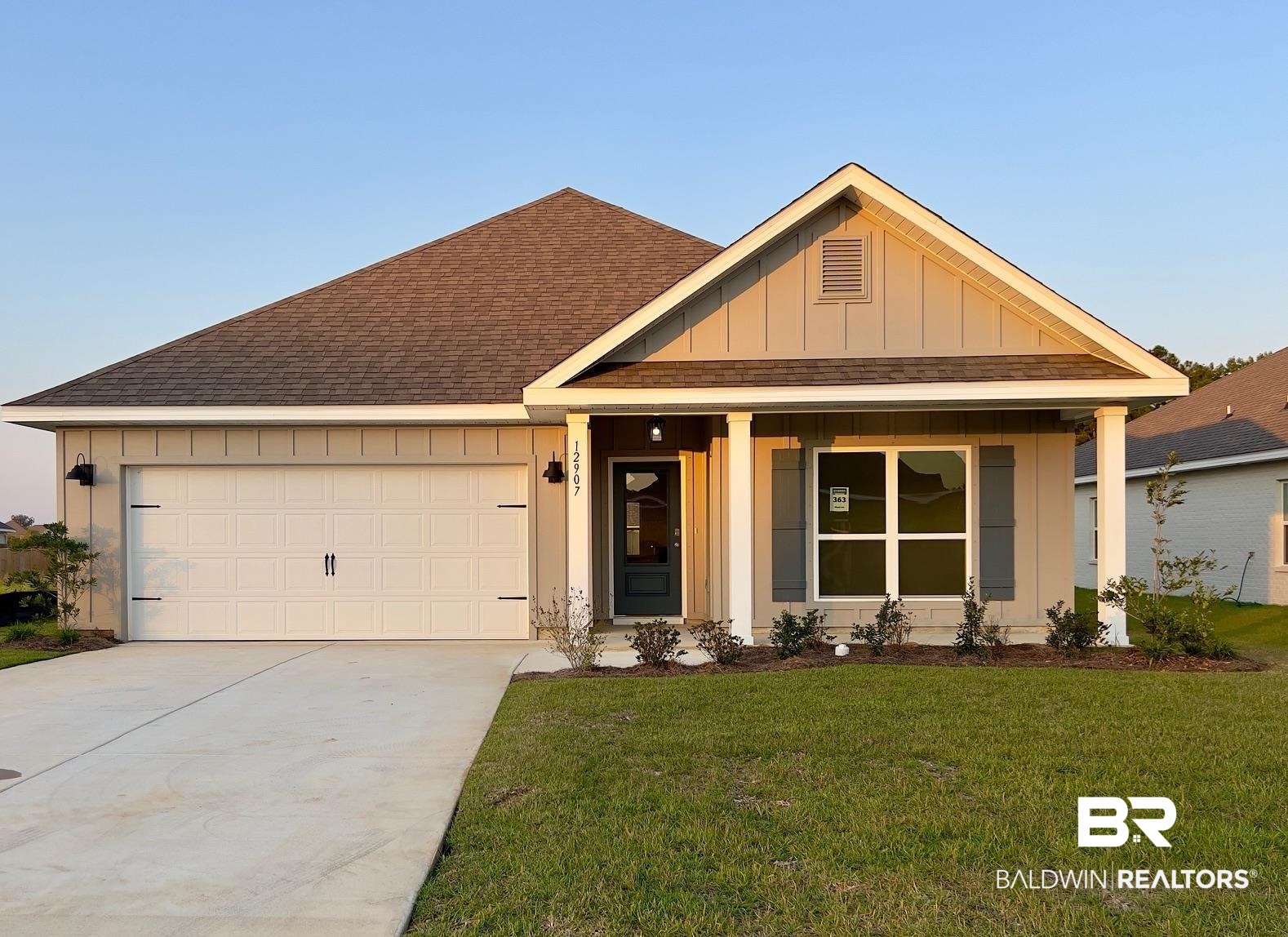 12907 Torrent Road Fairhope, AL 36532 - Photo 1 of 31 View of front of house featuring a front lawn and a garage