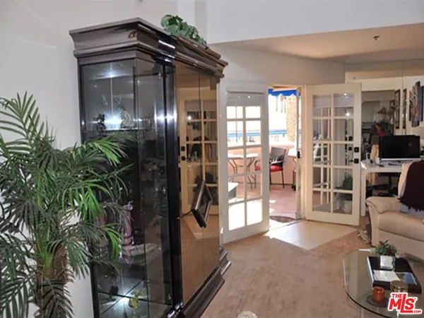 a view of livingroom with furniture and floor to ceiling window