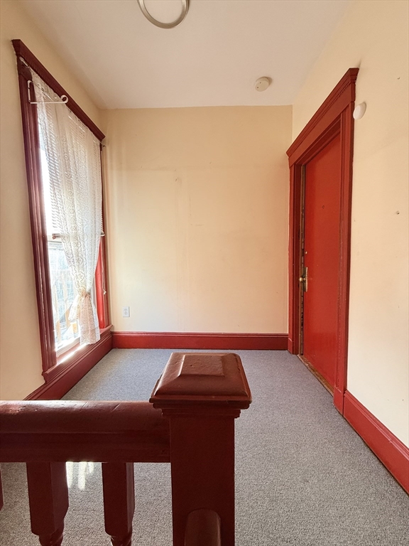253 Norfolk Street, Unit 3 Boston, MA 02124 - Photo 13 of 14 a room with a bed and a window