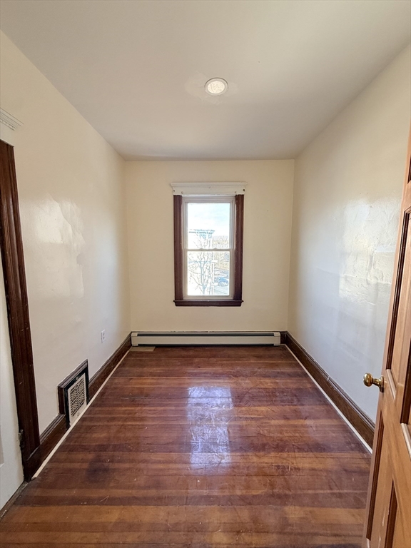 253 Norfolk Street, Unit 3 Boston, MA 02124 - Photo 6 of 14 a view of an empty room and window
