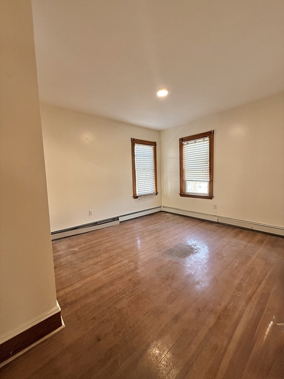 253 Norfolk Street, Unit 3 Boston, MA 02124 - Photo 8 of 14 an empty room with windows