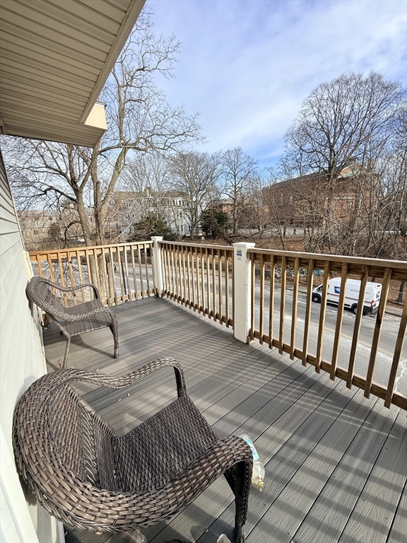253 Norfolk Street, Unit 3 Boston, MA 02124 - Photo 10 of 14 a view of a roof deck with wooden floor and fence