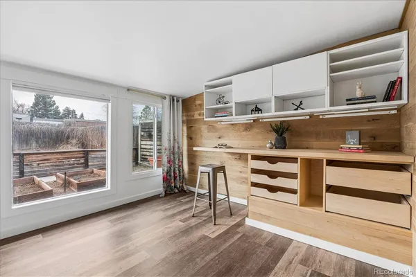 a view of a kitchen with cabinets and wooden floor