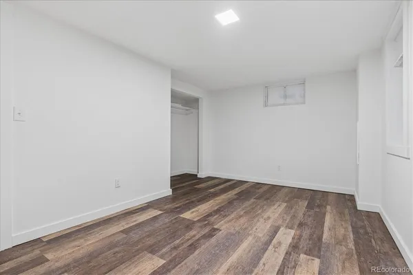 a view of room with wooden floor