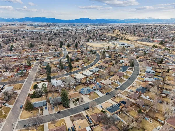 an aerial view of residential houses with outdoor space