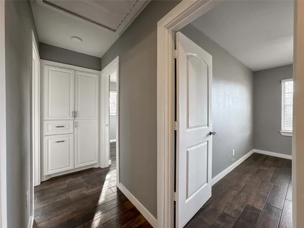 a view of kitchen with granite countertop cabinets and wooden floor