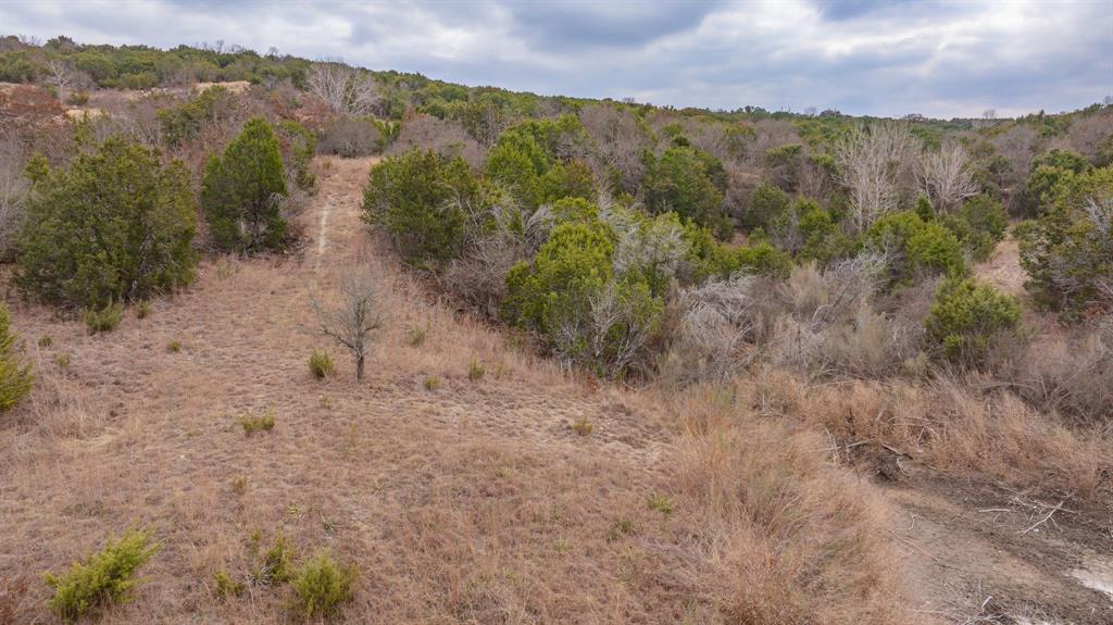 915 Anchor Way Bluff Dale, TX 76433 - Photo 15 of 37 a view of a lake with mountains in the background