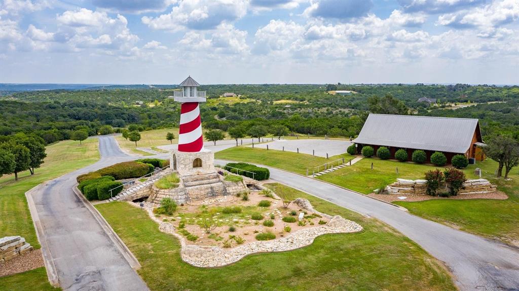 915 Anchor Way Bluff Dale, TX 76433 - Photo 20 of 37 an aerial view of a house with swimming pool lake view and mountain view