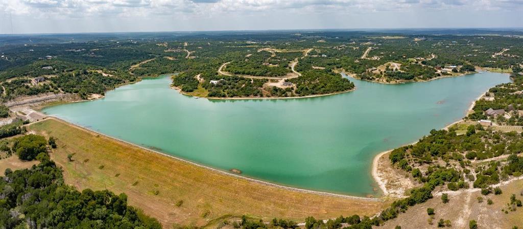 915 Anchor Way Bluff Dale, TX 76433 - Photo 21 of 37 an aerial view of a house with a lake view