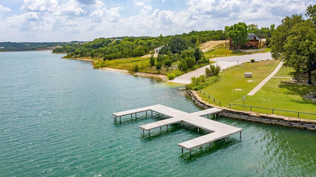 915 Anchor Way Bluff Dale, TX 76433 - Photo 28 of 37 an aerial view of a house with a garden and lake view