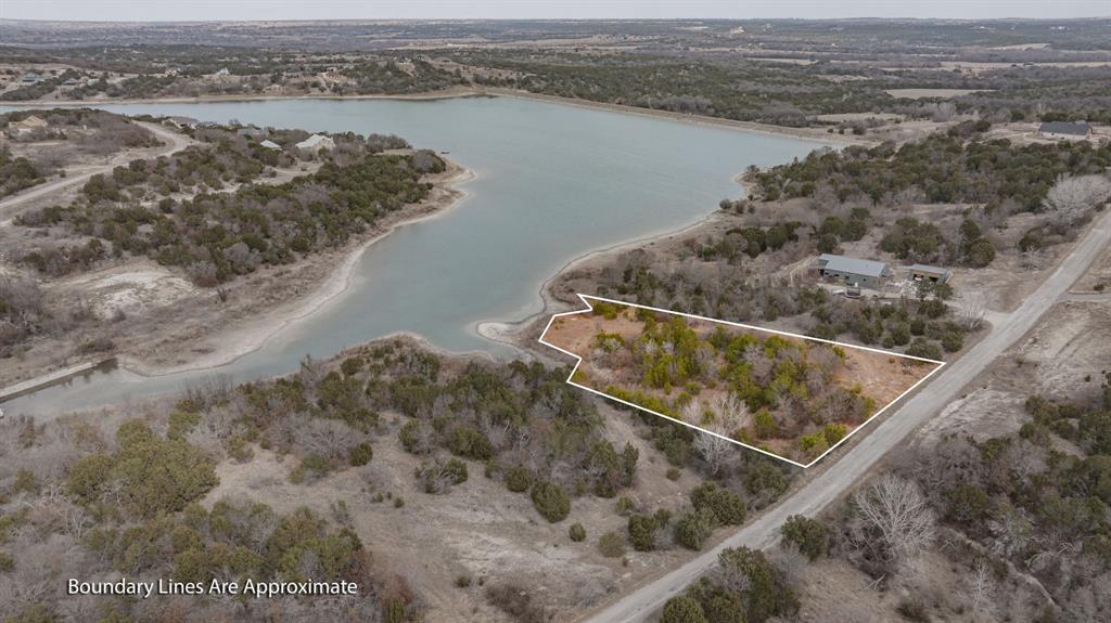 915 Anchor Way Bluff Dale, TX 76433 - Photo 3 of 37 a view of a lake from a balcony