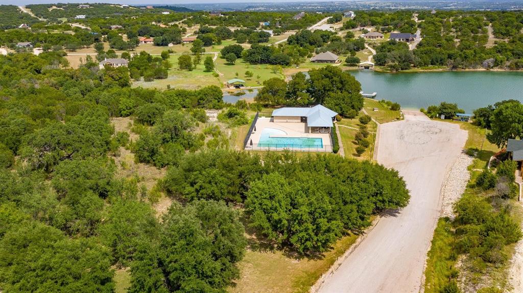915 Anchor Way Bluff Dale, TX 76433 - Photo 32 of 37 an aerial view of residential houses with outdoor space and lake view